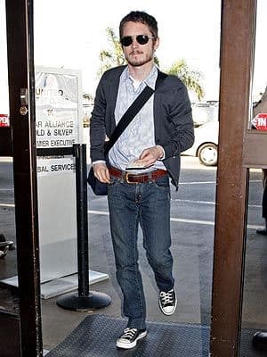 Elijah Wood’s Charcoal Cardigan & Striped Shirt Outfit