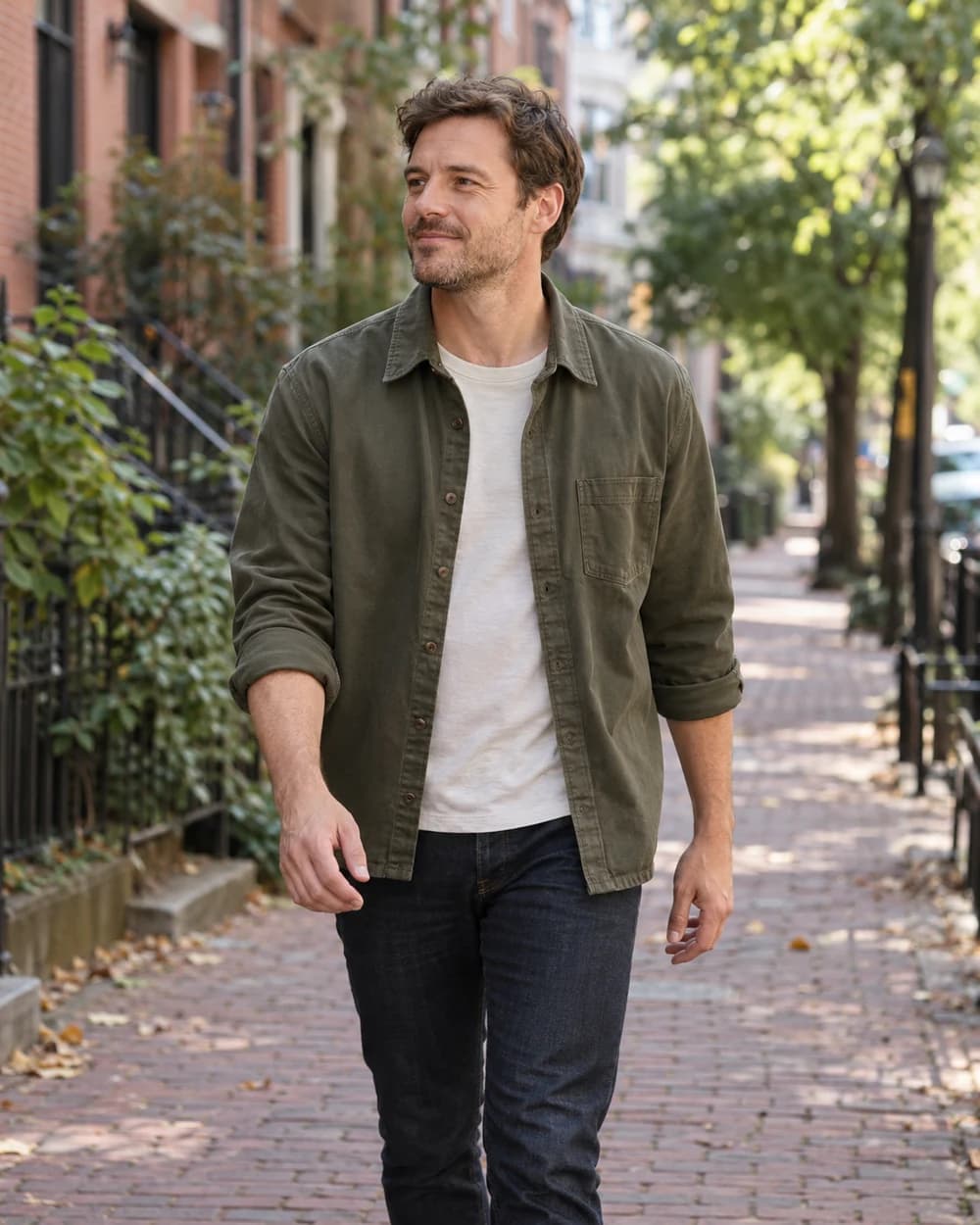 Olive overshirt layered over a white tee with dark jeans