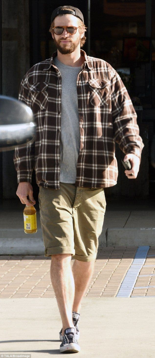 Liam Hemsworth’s Brown Plaid Shirt & Khaki Shorts Outfit