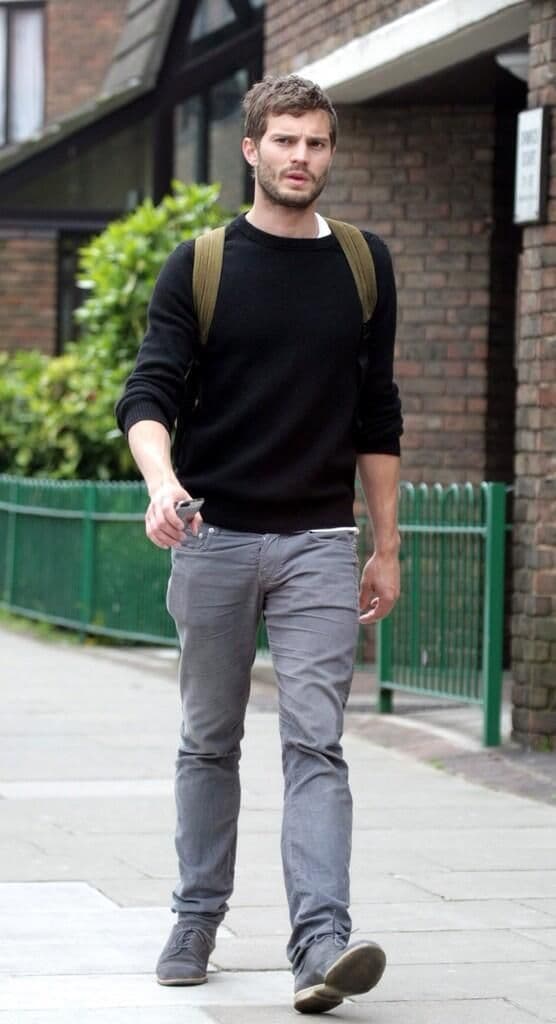 Jamie Dornan’s Black Sweater & Gray Jeans Outfit