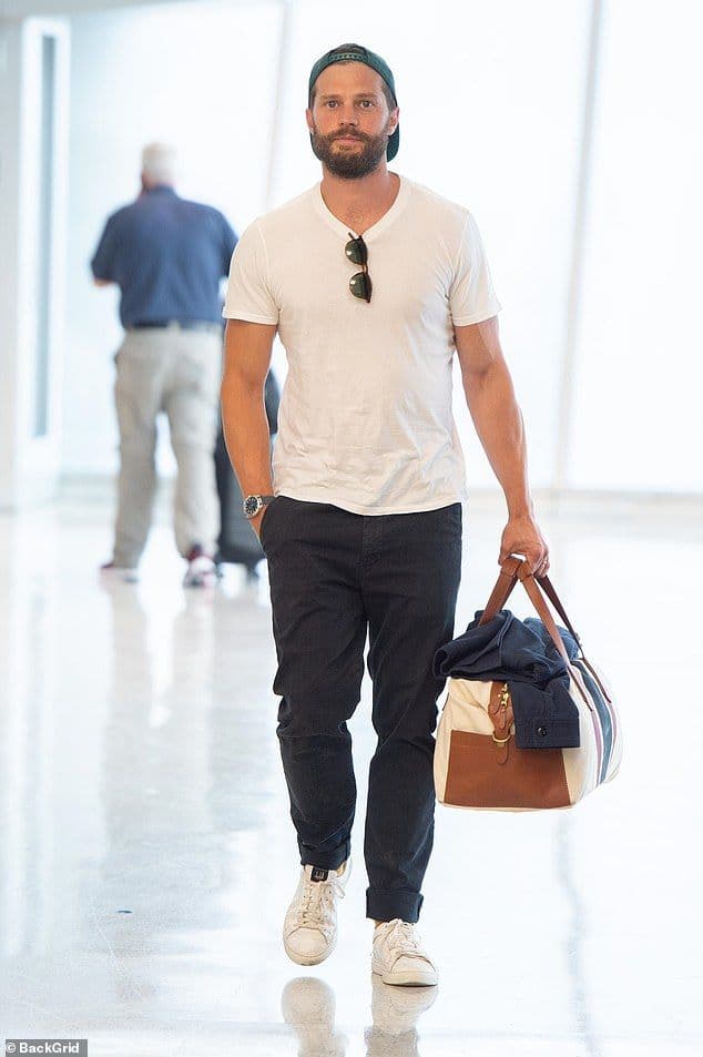Jamie Dornan’s White T-Shirt & Dark Jeans Airport Outfit